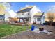 Well-kept backyard with a wooden deck, cozy fire pit area, and garden plots, perfect for outdoor enjoyment at 409 Machost Dr, Garner, NC 27529