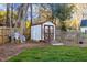 Backyard shed in well kept lawn and garden area provides organized and convenient storage solutions for outdoor equipment and tools at 409 Machost Dr, Garner, NC 27529
