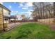 Expansive backyard with a wooden deck, manicured lawn, and a privacy fence, perfect for Gathering gatherings at 409 Machost Dr, Garner, NC 27529