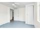 Bedroom offers neutral walls, painted floors, closet, and bright windows at 415 Estell St, Rocky Mount, NC 27803