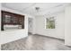 Bright room with gray floors, a window and a wood cupboard at 415 Estell St, Rocky Mount, NC 27803