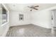 Spacious living room featuring gray wood-look floors, neutral walls, and a ceiling fan at 415 Estell St, Rocky Mount, NC 27803
