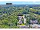 Aerial view of a home in a wooded area, conveniently located just 10.2 miles from Durham at 44 Grandwood Cir, Durham, NC 27712