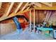 Unfinished attic space featuring exposed beams and ample storage at 44 Grandwood Cir, Durham, NC 27712