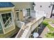 Elevated wooden deck featuring outdoor seating, connected by stairs, offering a cozy outdoor space at 44 Grandwood Cir, Durham, NC 27712