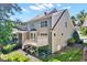 Exterior view of a multi-story home with a deck, showing the backyard and landscaping at 44 Grandwood Cir, Durham, NC 27712