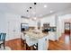 Well-lit kitchen featuring stainless steel appliances, granite countertops, and an island with bar seating at 44 Grandwood Cir, Durham, NC 27712