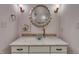 Stylish bathroom featuring a vessel sink, modern faucet, decorative mirror and tiled backsplash at 45 Calabria Ct, Clayton, NC 27527