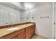 Bathroom features a double sink vanity, a granite countertop, and wood cabinets at 45 Calabria Ct, Clayton, NC 27527