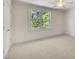 Bright bedroom with neutral carpeting and a window offering tree views at 45 Calabria Ct, Clayton, NC 27527