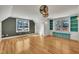 Spacious bonus room with wood floors, a window seat, and modern lighting at 45 Calabria Ct, Clayton, NC 27527