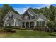 Charming two-story home featuring stone accents, landscaped front yard and inviting covered front porch at 45 Calabria Ct, Clayton, NC 27527