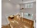 Open-concept living room with tall ceilings, hardwood floors, and a seamless flow to kitchen and fireplace at 45 Calabria Ct, Clayton, NC 27527