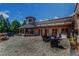 Expansive outdoor patio area with stone fireplace, pergola, and seating, perfect for entertaining at 45 Calabria Ct, Clayton, NC 27527