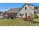 Expansive backyard offers mature trees, a covered patio, and lush landscaping for outdoor relaxation at 49 Everwood Dr, Four Oaks, NC 27524