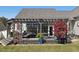 Landscaped backyard with pergola-covered deck and patio at 49 Everwood Dr, Four Oaks, NC 27524