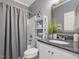 Well-maintained bathroom with granite countertop, modern fixtures, and shower at 49 Everwood Dr, Four Oaks, NC 27524