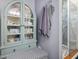 Bathroom interior with vintage cabinet, hanging towels, and view of the stand up shower at 49 Everwood Dr, Four Oaks, NC 27524