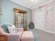 Bright bedroom with light colors, display cabinet, and soft decor at 49 Everwood Dr, Four Oaks, NC 27524