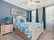 Charming bedroom features bright decor and a decorative accent window above the bed at 49 Everwood Dr, Four Oaks, NC 27524