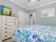 Cozy bedroom with neutral colors, an artistic painting, and access to the bathroom at 49 Everwood Dr, Four Oaks, NC 27524