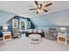 Bonus room featuring a ceiling fan, seating, and natural light at 49 Everwood Dr, Four Oaks, NC 27524