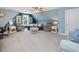 Bonus room featuring a ceiling fan, seating, and natural light at 49 Everwood Dr, Four Oaks, NC 27524