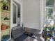 Entrance with grey brick steps, white siding and a view into the kitchen at 49 Everwood Dr, Four Oaks, NC 27524
