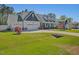 Charming two-story home with landscaped yard, a spacious driveway, and a welcoming entrance at 49 Everwood Dr, Four Oaks, NC 27524