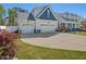 Charming home with attached two-car garage, beautiful landscaping, and ample parking at 49 Everwood Dr, Four Oaks, NC 27524