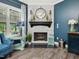 Close-up of a modern fireplace with white brick surround and decorative accents at 49 Everwood Dr, Four Oaks, NC 27524