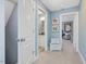 Hallway featuring white doors and blue walls, leading to other rooms in the house at 49 Everwood Dr, Four Oaks, NC 27524