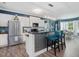 Kitchen featuring stainless steel appliances, an island with seating, and eat-in dining at 49 Everwood Dr, Four Oaks, NC 27524