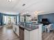 Eat in kitchen with granite countertops and stainless steel appliances at 49 Everwood Dr, Four Oaks, NC 27524