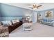 Cozy living room with plush seating, ceiling fan, and decor at 49 Everwood Dr, Four Oaks, NC 27524