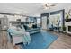 Spacious living room featuring a cozy fireplace, plush seating, and seamless flow to the kitchen at 49 Everwood Dr, Four Oaks, NC 27524