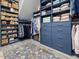 Spacious walk-in closet features custom shelving, drawers, and a large floral rug at 49 Everwood Dr, Four Oaks, NC 27524
