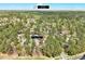 Bird's-eye view shows property's proximity to Durham, surrounded by lush forest scenery at 500 W Woodcroft Pkwy, Durham, NC 27713