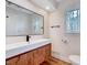 Modern bathroom with a floating vanity, sleek mirror, and bright natural light at 500 W Woodcroft Pkwy, Durham, NC 27713