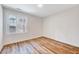 Bright bedroom with hardwood floors, large window and natural light at 500 W Woodcroft Pkwy, Durham, NC 27713