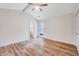 Well-lit bedroom with ceiling fan, hardwood floors and access to a bathroom at 500 W Woodcroft Pkwy, Durham, NC 27713