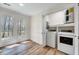 Laundry room with washer, dryer and doors to outside deck at 500 W Woodcroft Pkwy, Durham, NC 27713