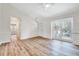 Bright living room with vaulted ceiling and wood floors at 500 W Woodcroft Pkwy, Durham, NC 27713