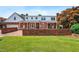 Spacious backyard with a brick patio and lush lawn, creating a relaxing outdoor oasis at 504 W Brocklyn St, Benson, NC 27504