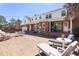 Large backyard brick patio featuring seating and string lights, ideal for outdoor entertaining at 504 W Brocklyn St, Benson, NC 27504