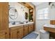 Bathroom boasts double sinks, unique lighting, and ample cabinet space at 504 W Brocklyn St, Benson, NC 27504