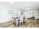 Inviting dining room with wood floors, wainscoting and comfortable seating at 504 W Brocklyn St, Benson, NC 27504