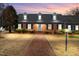 Beautiful brick home with dormer windows and well-manicured landscaping at 504 W Brocklyn St, Benson, NC 27504