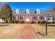 Classic brick home with a well-maintained lawn and a walkway leading to the front door at 504 W Brocklyn St, Benson, NC 27504