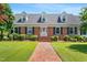 Inviting brick home with manicured lawn, dormer windows, and a welcoming entrance at 504 W Brocklyn St, Benson, NC 27504